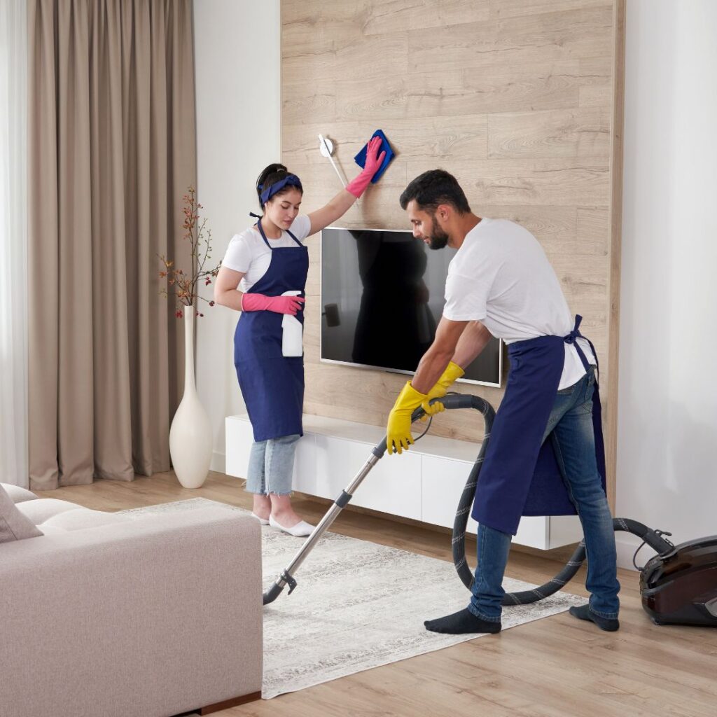 two people cleaning